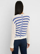 Cream open-knit cardigan with blue horizontal stripes and a vertical chevron detail down the back.