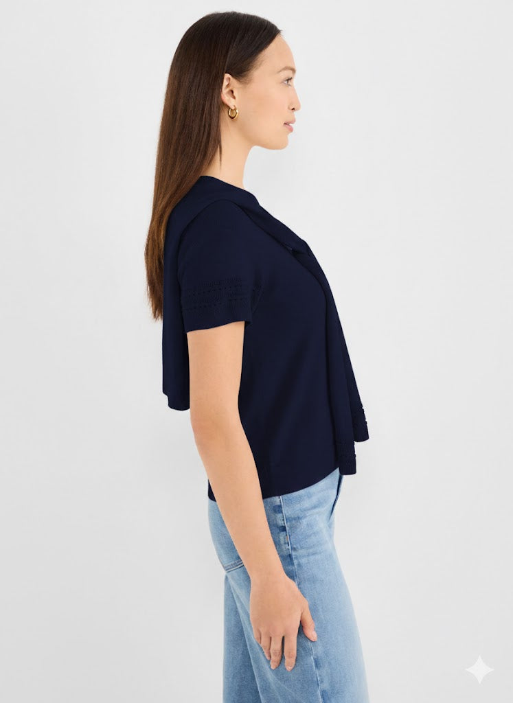 Navy blue knit short-sleeve open cardigan featuring a draped shawl collar and pointelle detail on the cuffs.