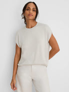 Pale greige shimmer sweater. Loose cocoon fit, round neck, short wide sleeves.