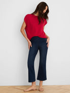 Red, loose-fit, round neck sweater with short sleeves.