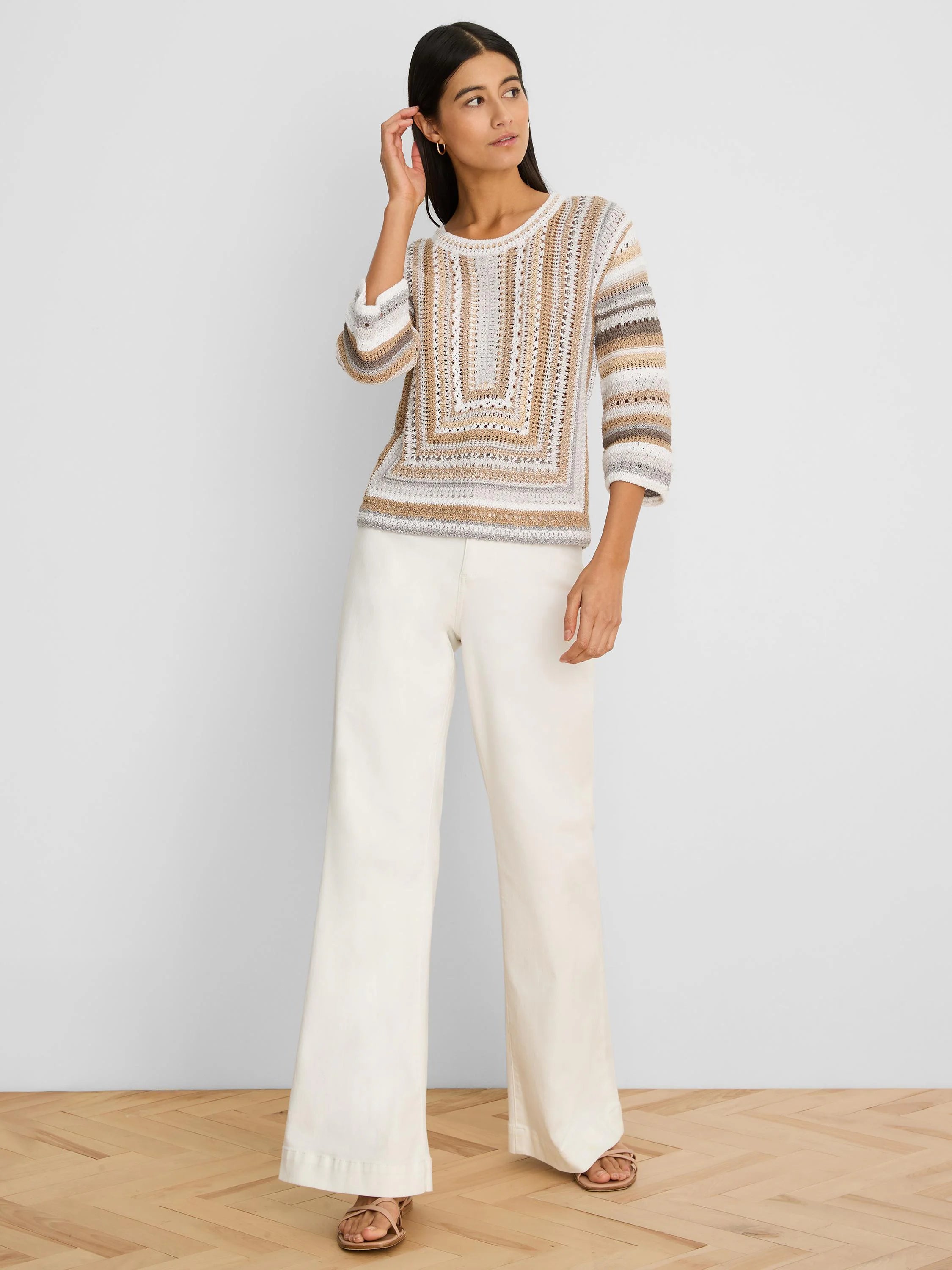 Open-knit sweater with cream, brown, and grey mixed patterns; central square design, 3/4 sleeves.