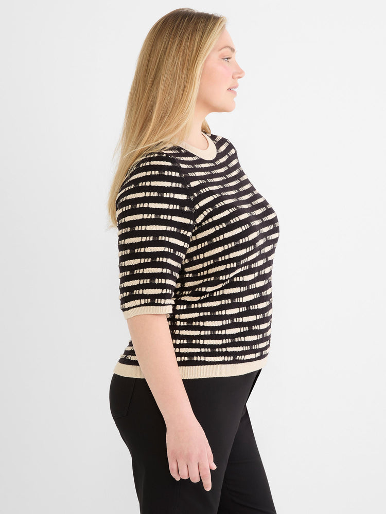 Black and tan fitted knit sweater with textured horizontal stripes, crewneck, and elbow sleeves.