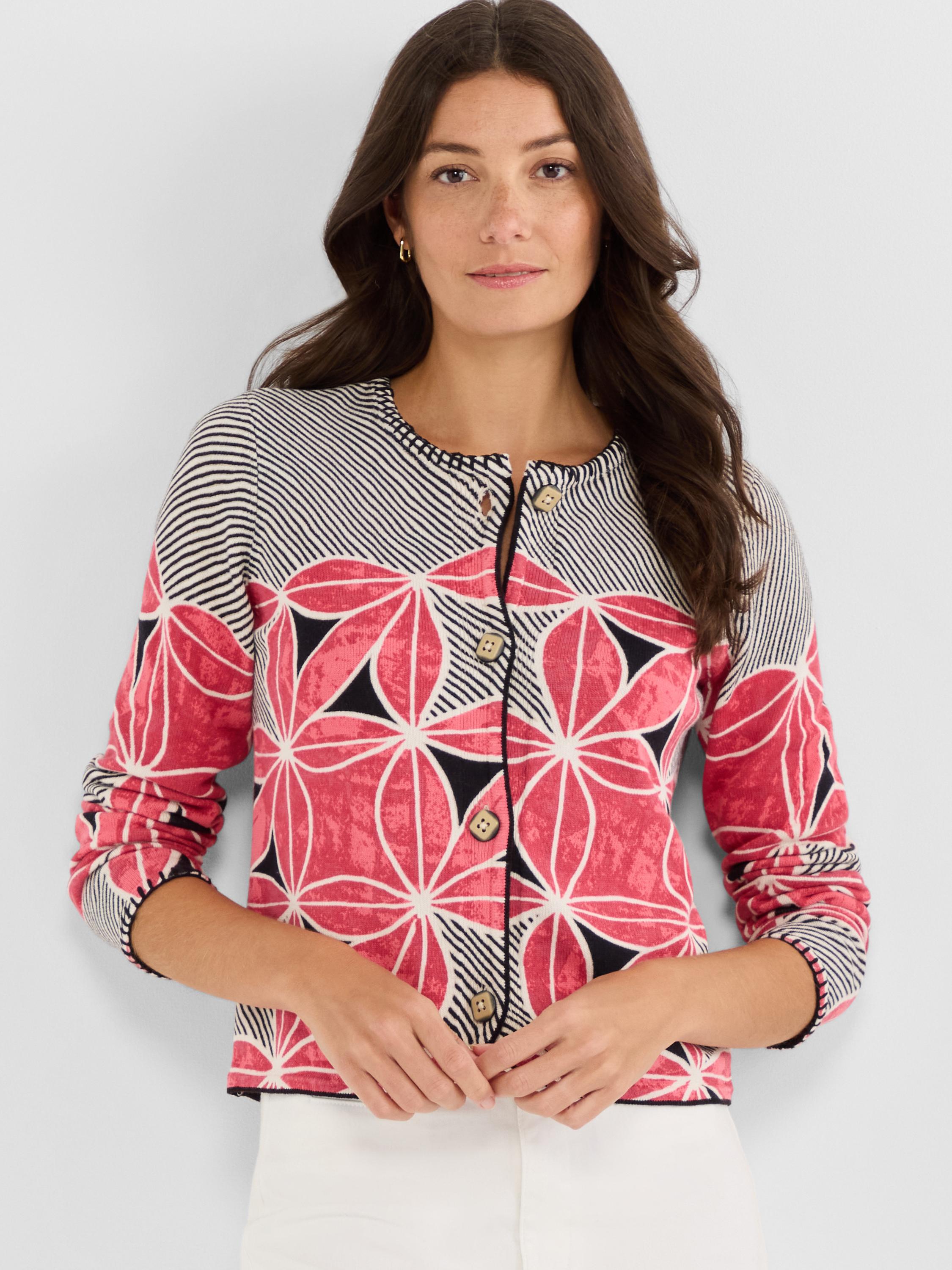 Cropped fitted cardigan with a mixed knit pattern of bold pink florals on the body and narrow black and white stripes on.