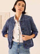 Textured blue knit jacket with fringe along open front and rolled cuffs. Features dark buttons.