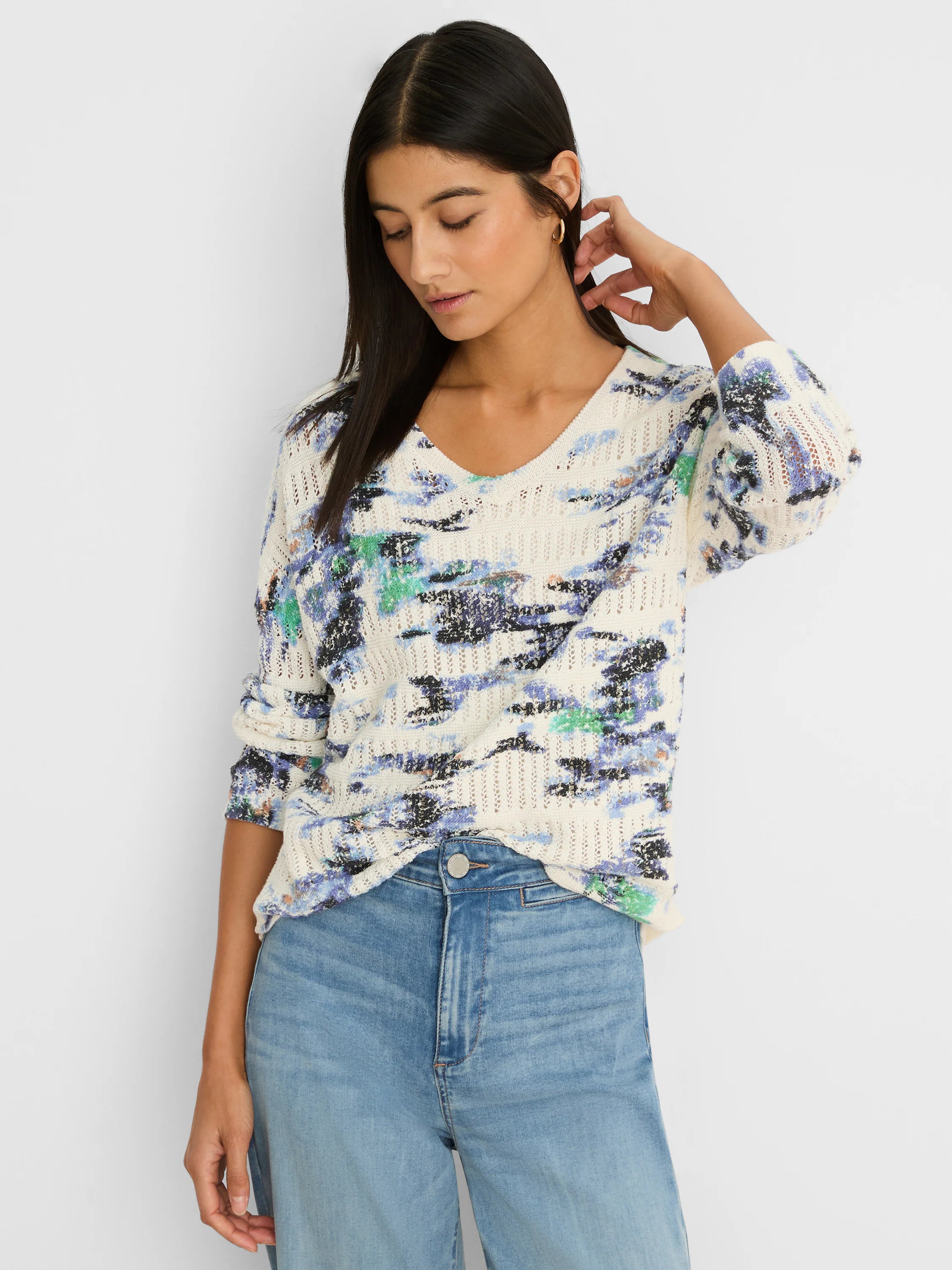 Off-white pointelle sweater with V-neck, featuring an abstract blue, green, and black water lily pattern.