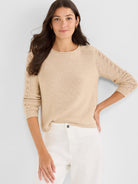 Beige relaxed fit crewneck sweater featuring delicate pointelle knit sleeves.