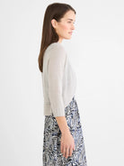 Light grey bolero cardigan, cropped with 3/4 sleeves and ribbed cuffs.