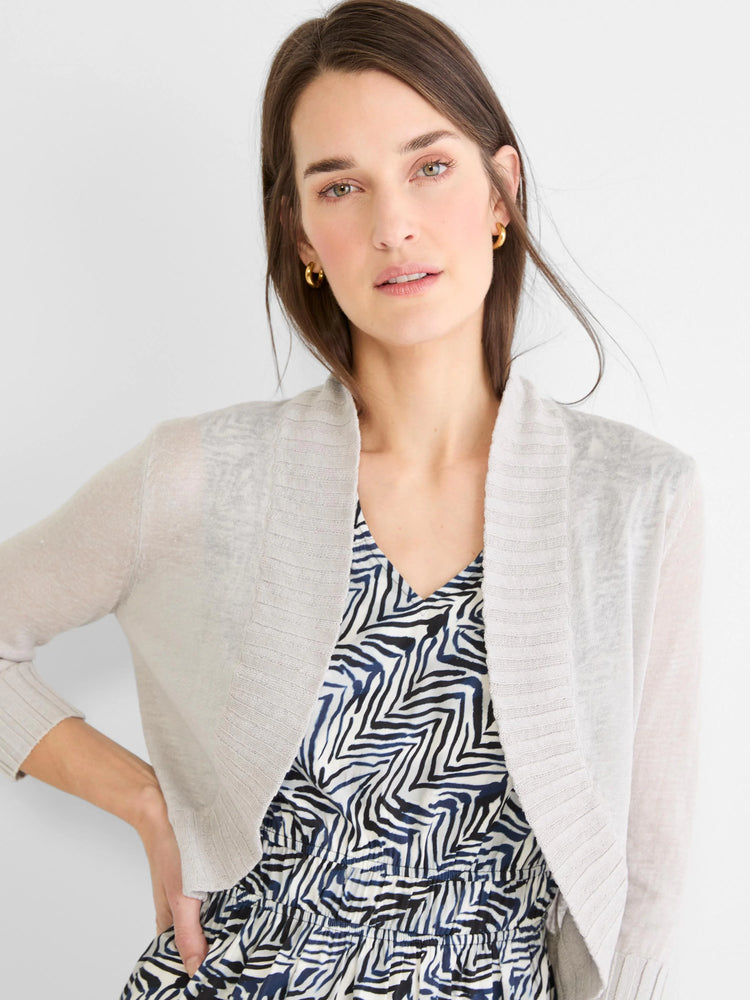 Light grey knit bolero cardigan with open front, long sleeves, and ribbed cuffs and front edges.