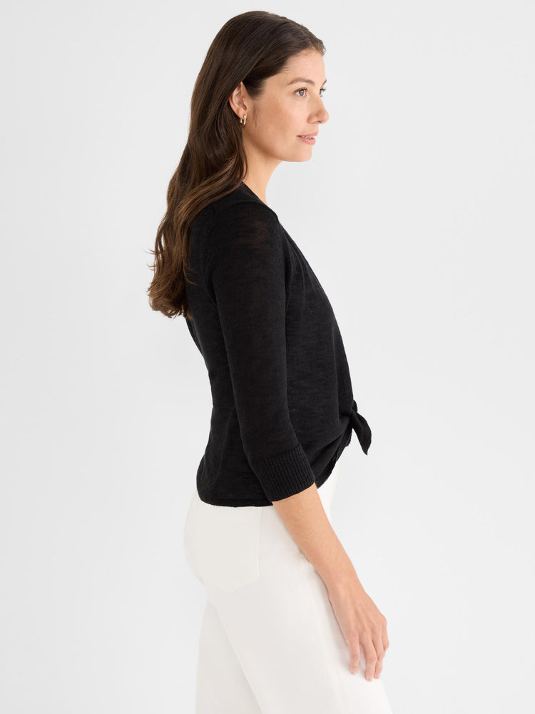 A fitted black lightweight cardigan features three-quarter sleeves and a knot closure tied at the front waist.