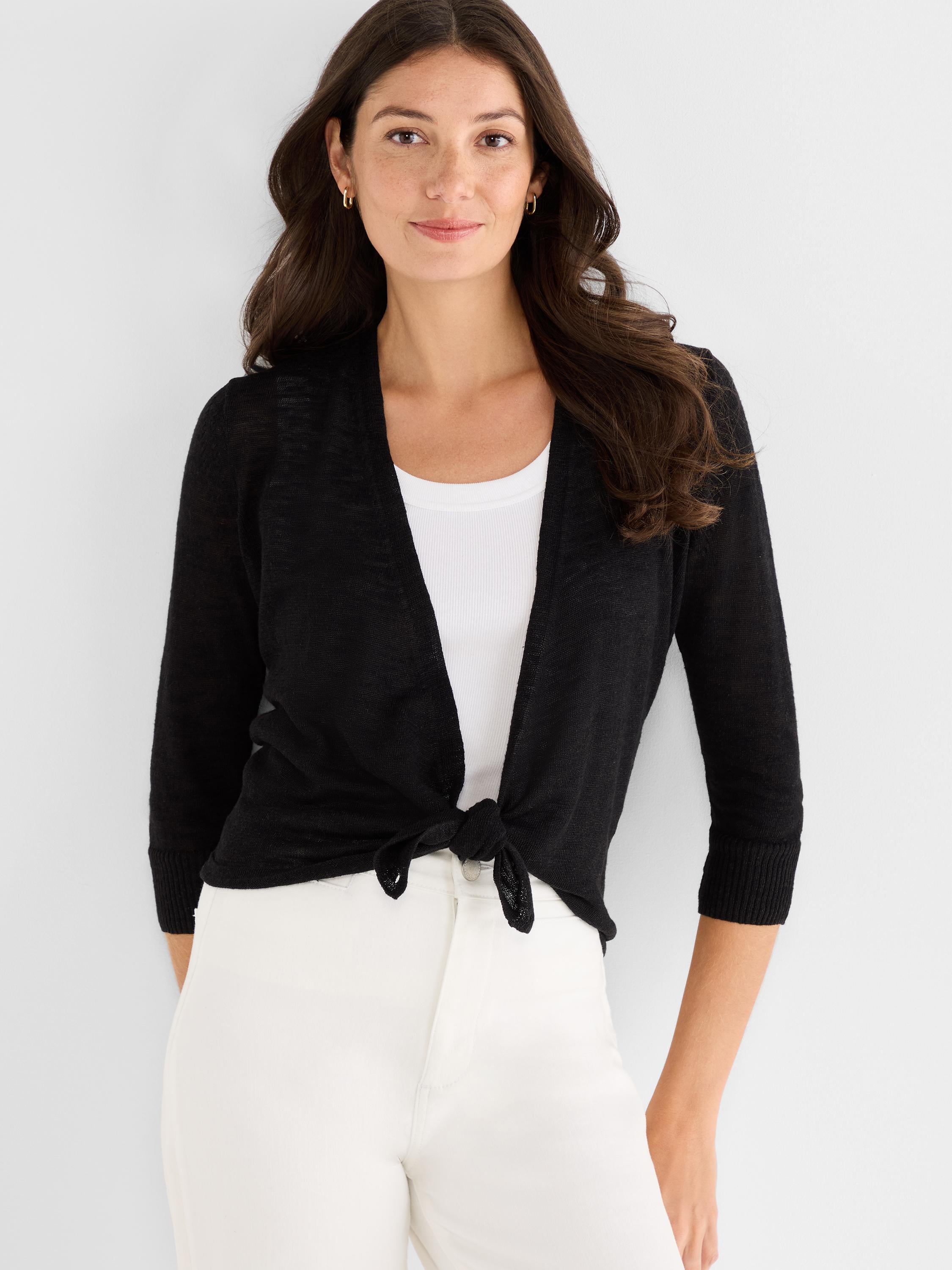 Black lightweight cardigan worn cropped featuring a front tie knot closure and elbow-length sleeves.