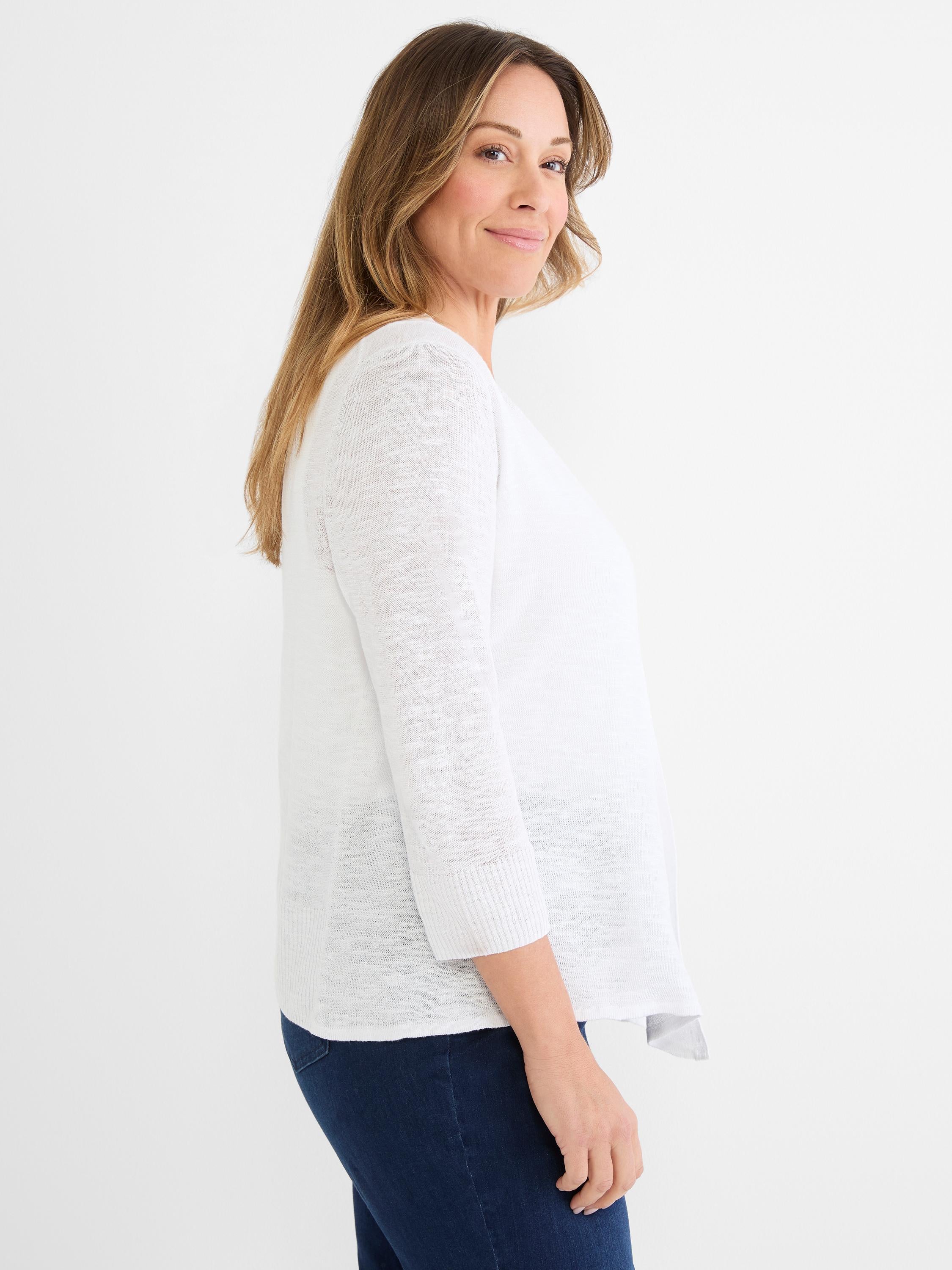 Model wears a white, lightweight knit cardigan with a flowy fit, three-quarter ribbed sleeves, and an open front.