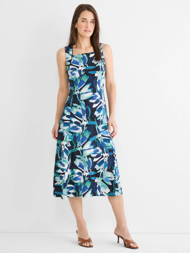 Sleeveless midi dress with an abstract leaf pattern in dark blue, light blue, teal, and white.