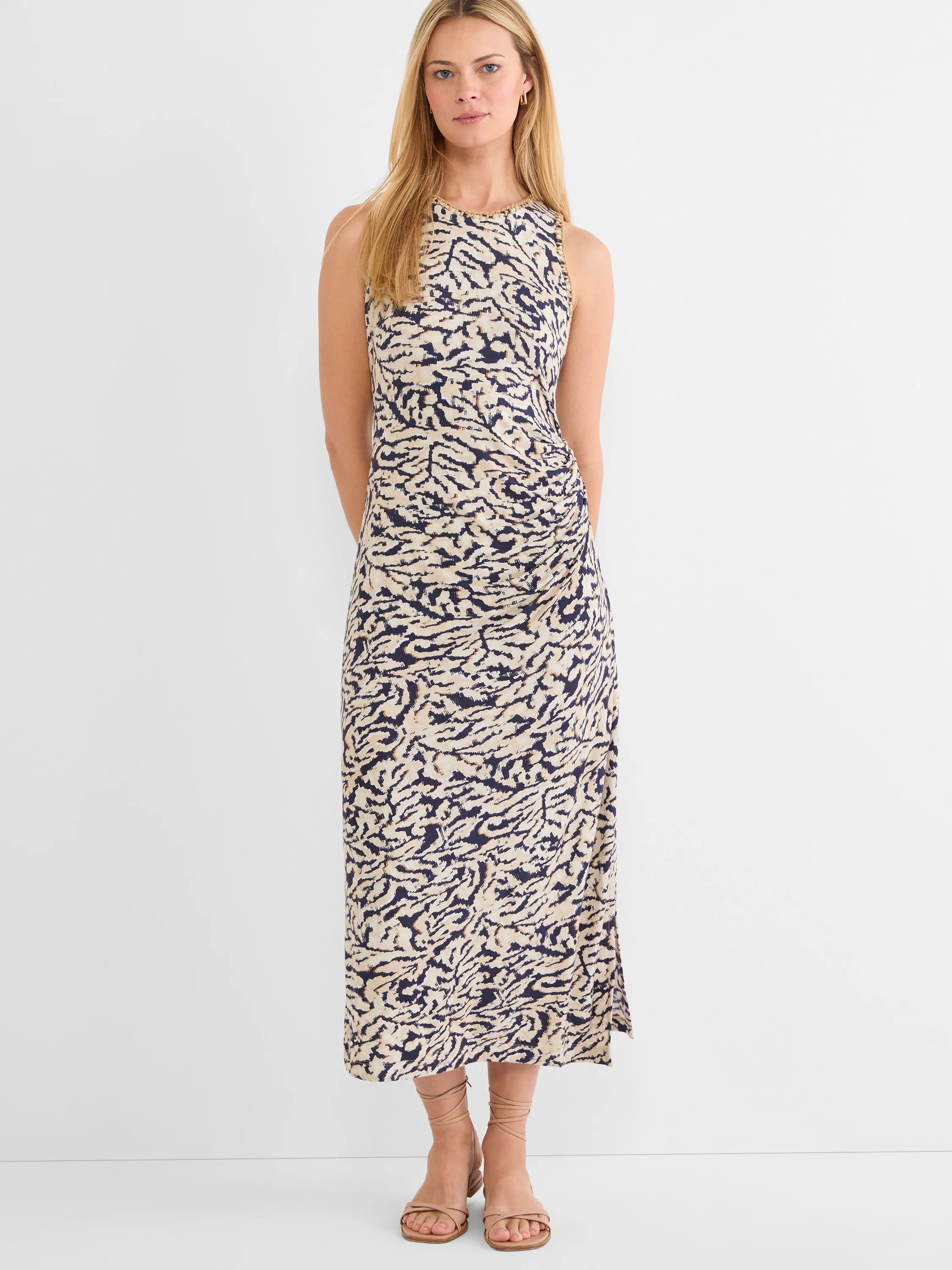Sleeveless maxi dress in navy and beige heather swirl pattern, with ruched side and braided trim neckline.