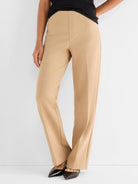High-waisted khaki tailored pants feature a smooth front and a structured straight leg silhouette.