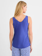 Back view: royal blue sleeveless tank, smooth fabric, V-neckline.