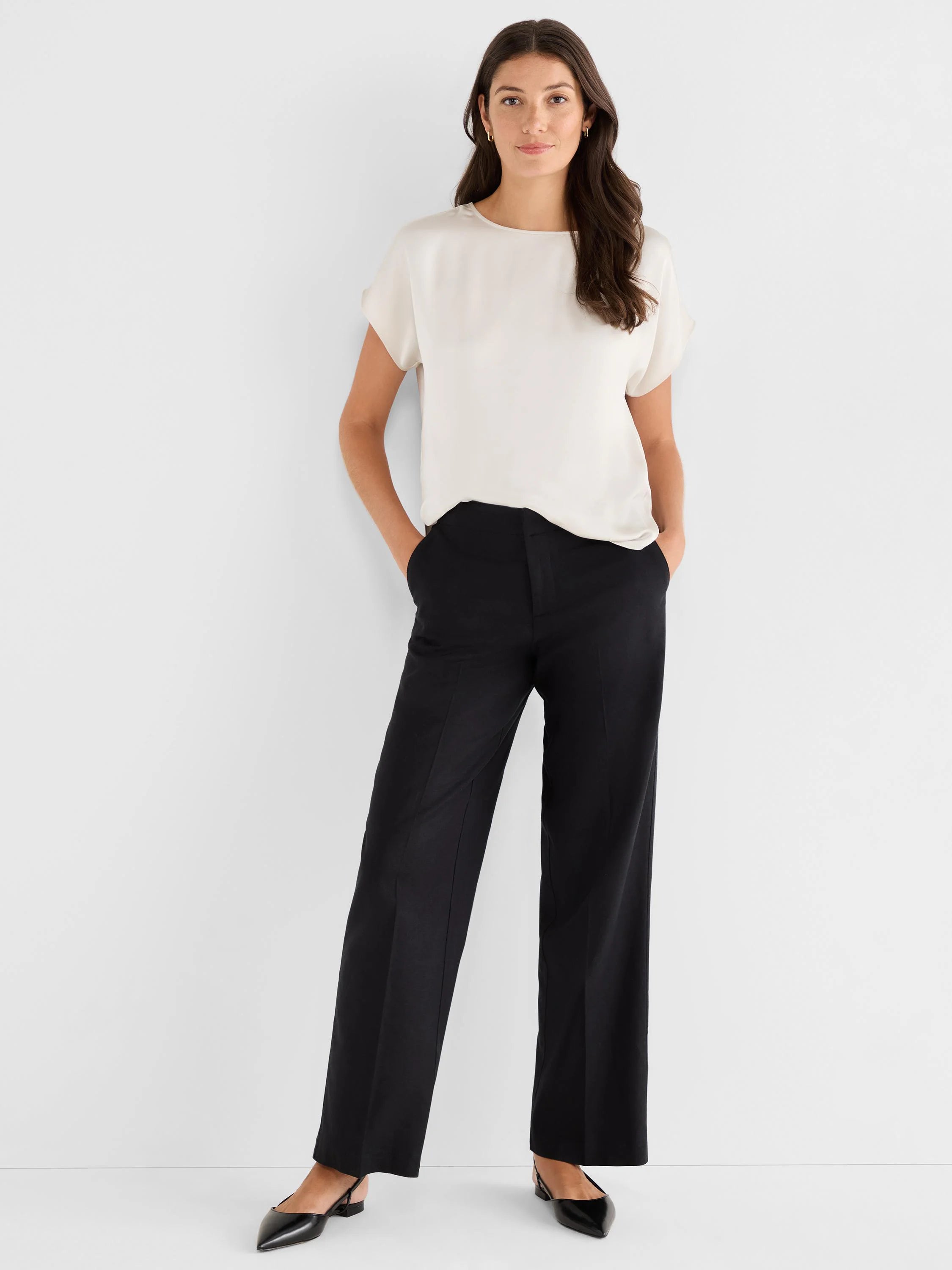 Off-white woven tee with a boat neck and short, relaxed sleeves. The fabric has a subtle sheen.