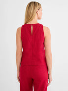 Red sleeveless tank. Visible linen texture, with a back keyhole opening and single button closure.