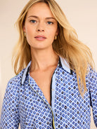 Blue & white shirt with mosaic pattern of blue, black, and gold diamonds. Light blue collar & yellow placket piping.
