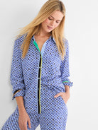 Blue mosaic pattern shirt with small diamond shapes in shades of blue, black, gold. Trimmed in bright green, yellow, black.