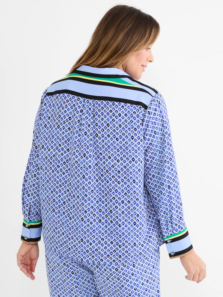 Blue mosaic pattern shirt with small diamonds in blue, black, white, gold. Striped trim in light blue, black, yellow, green.