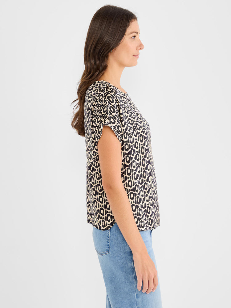 This relaxed black and beige geometric print blouse features short cap sleeves and a round neck.