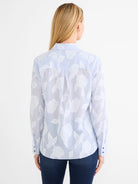 Sky blue and white striped shirt with white floral jacquard pattern. Back view.