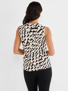 This black and cream abstract print sleeveless blouse has a relaxed fit and a mock neck collar detail.