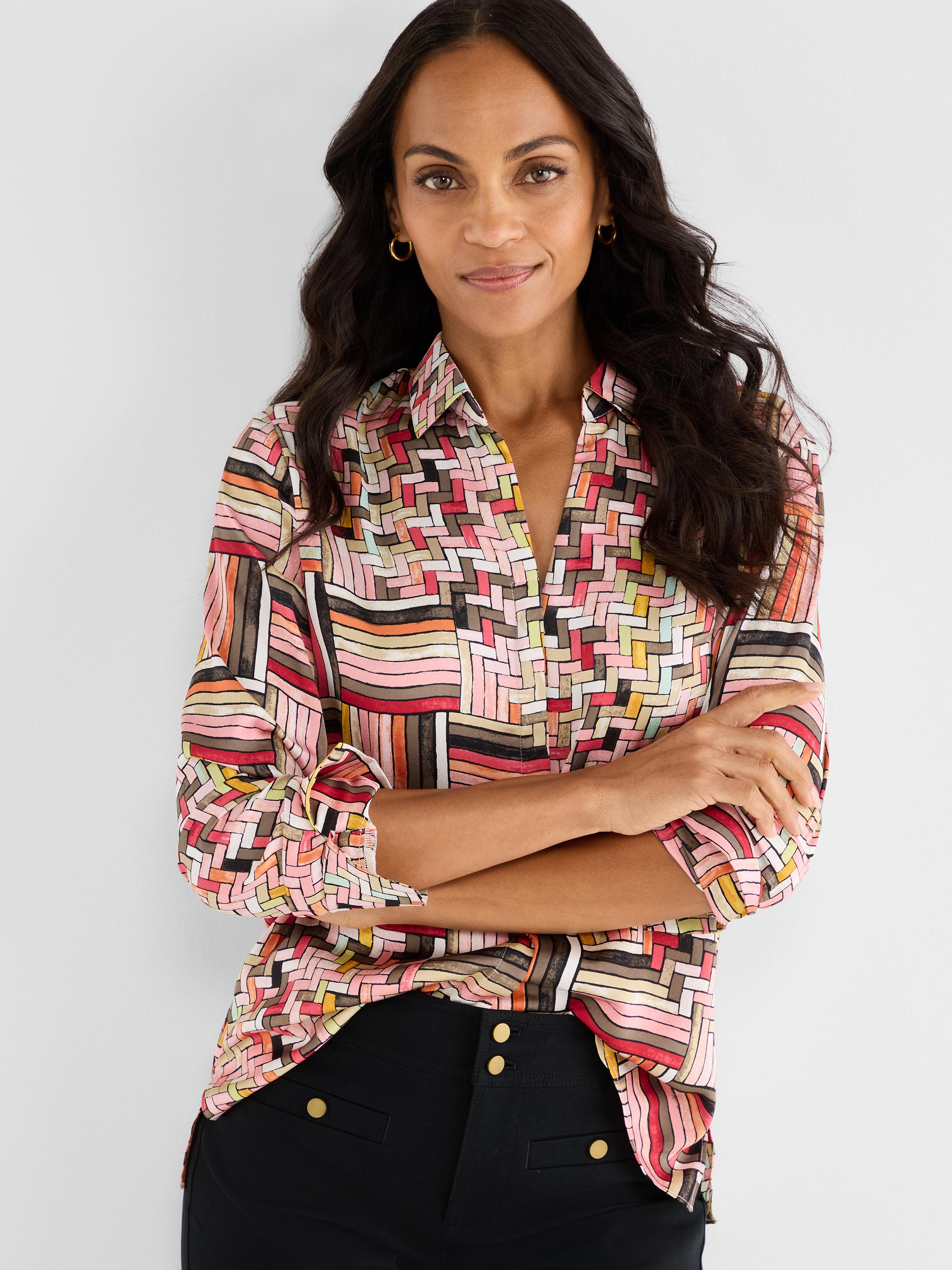 Model wears a relaxed fit multicolor abstract print button-up shirt featuring a pointed collar.