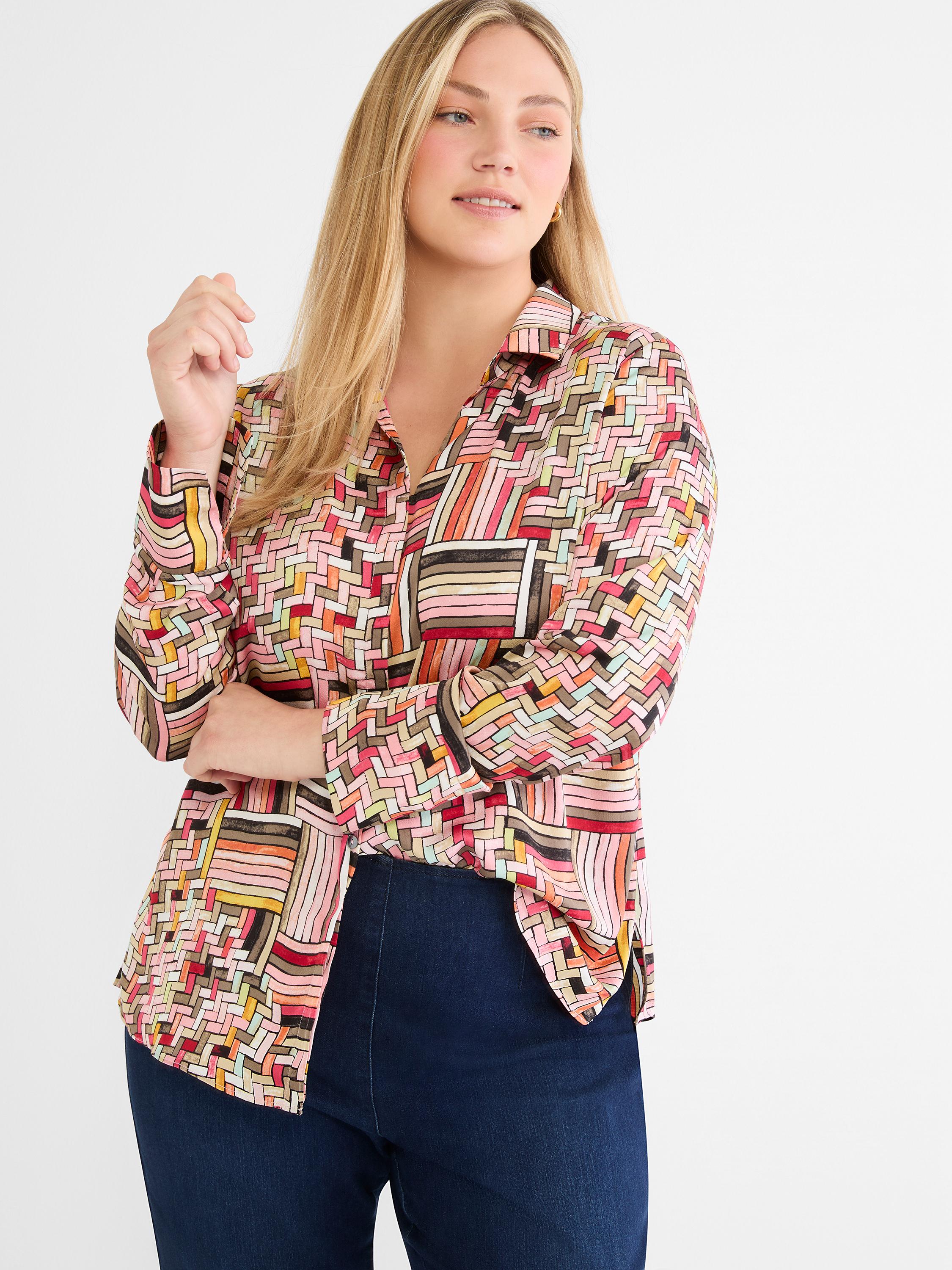 Multicolor geometric print button-up shirt with long sleeves and a chest pocket, worn with dark denim.