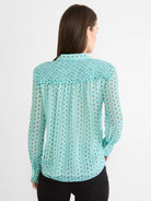 Chiffon shirt: aqua, light blue, white, grey geometric "steps" pattern. Shirred upper back & long sleeves.
