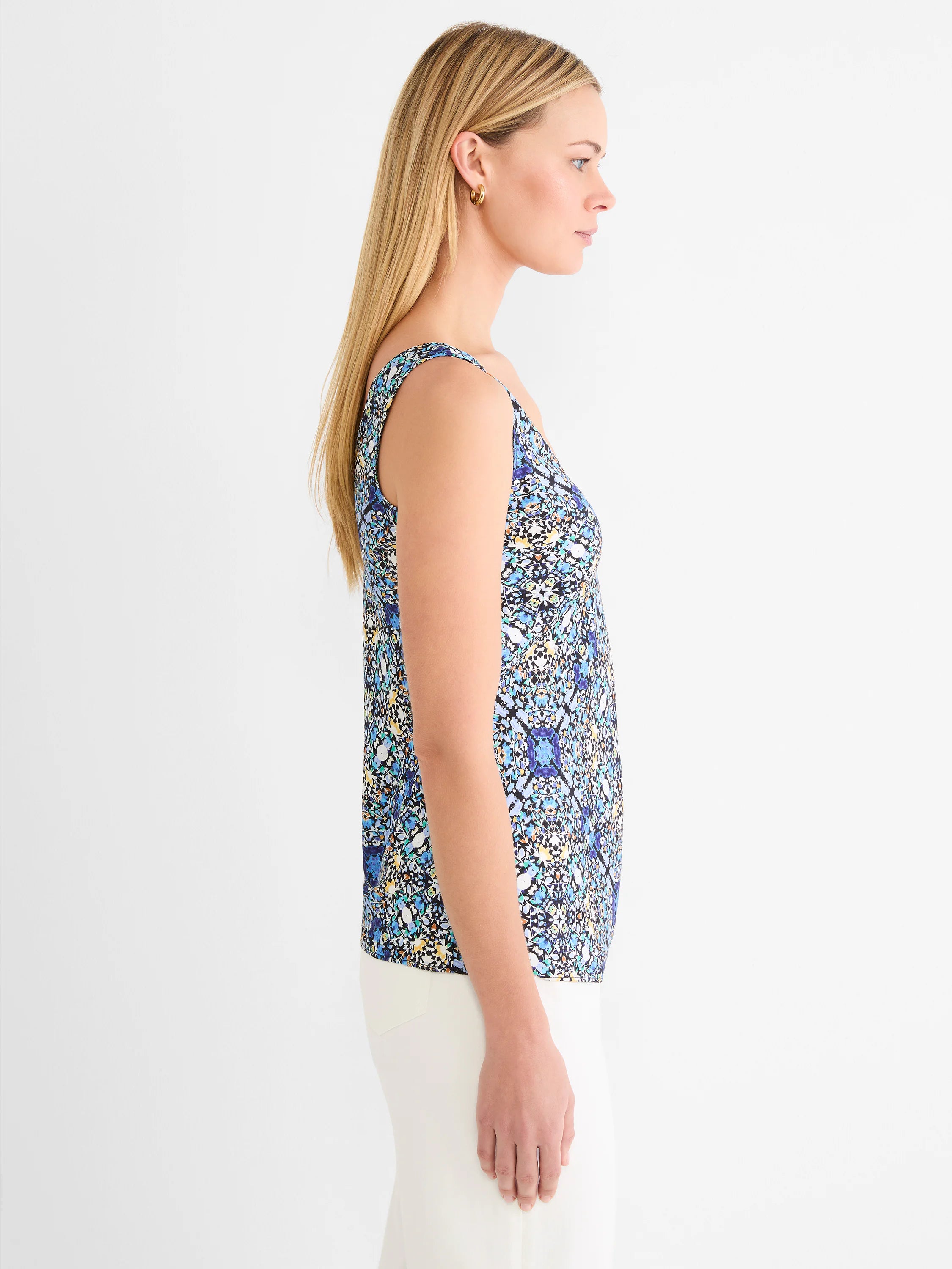 Sleeveless tank with an intricate filagree tile pattern in shades of blue, teal, and yellow on a dark background.