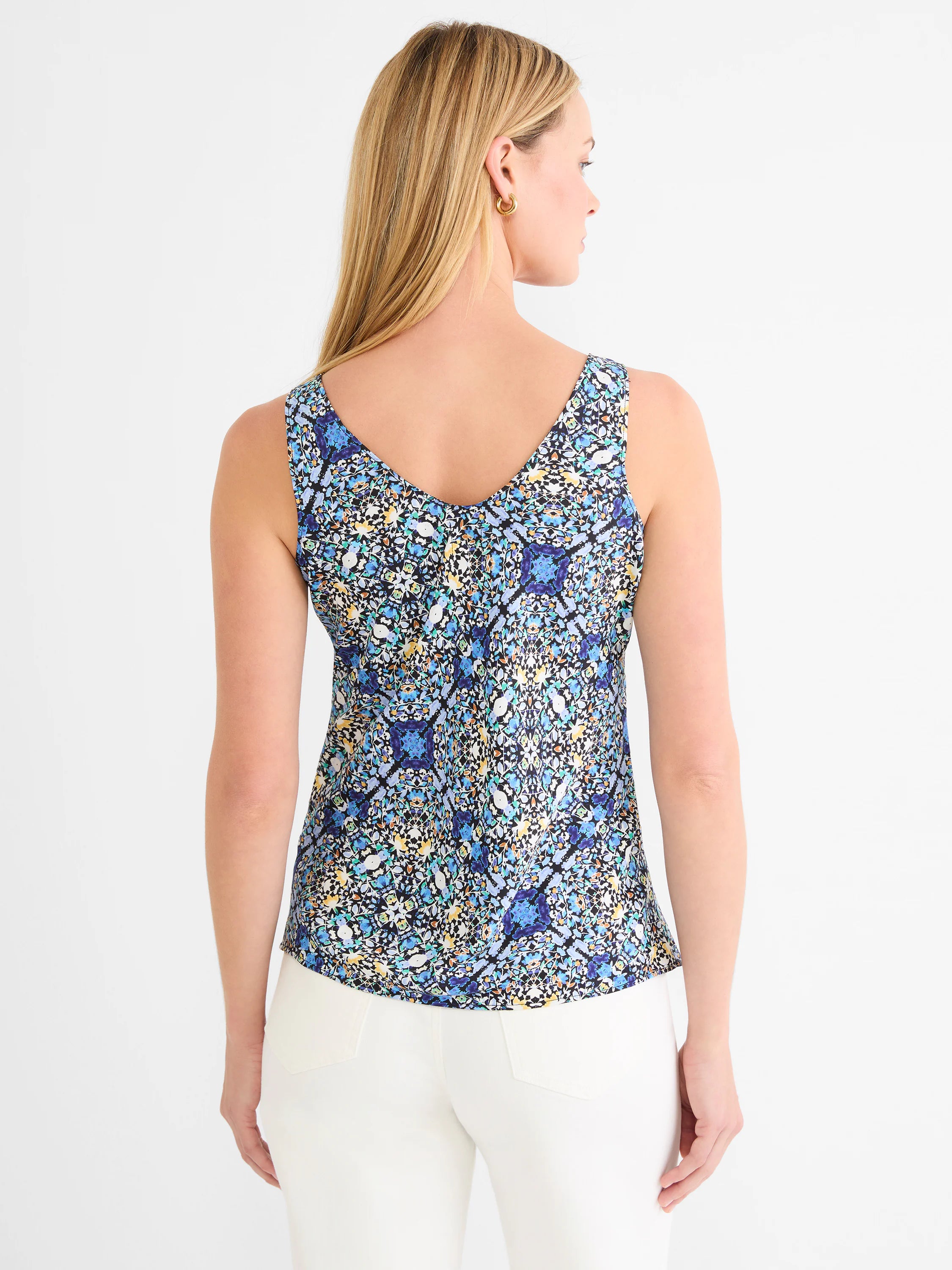 Tank top, back view. Intricate filigree tile pattern in blues, black, white, teal, & yellow, with a V-neck.