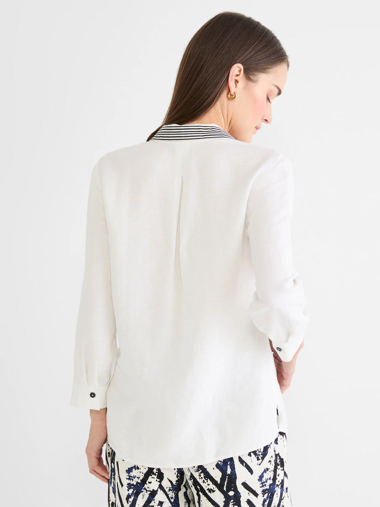 Back view white linen shirt. Black & white striped inner collar, rolled sleeves with dark buttons.