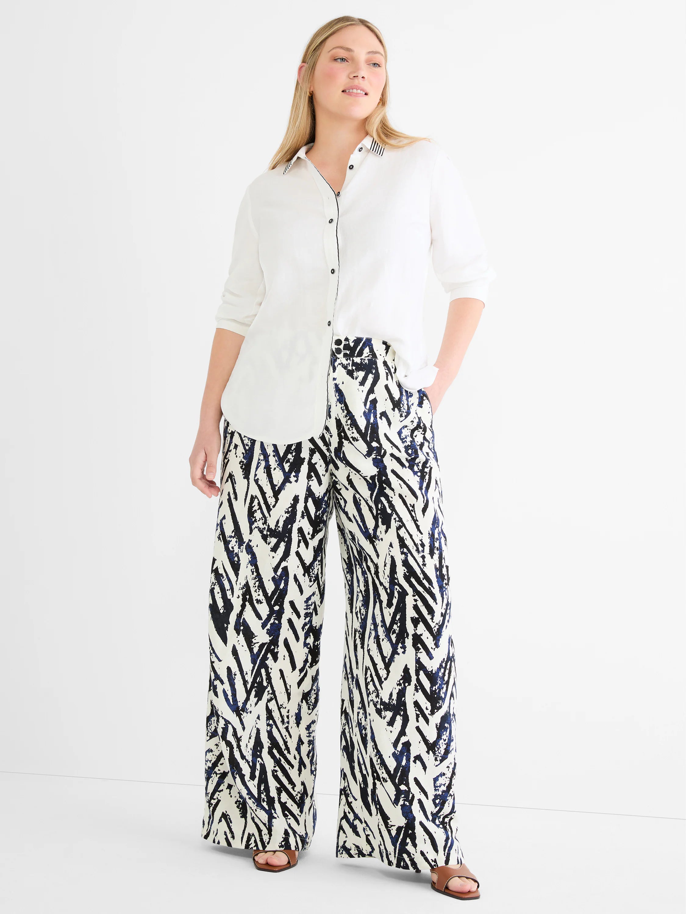 White linen shirt with black & white striped collar band, black piping on collar edge and placket.