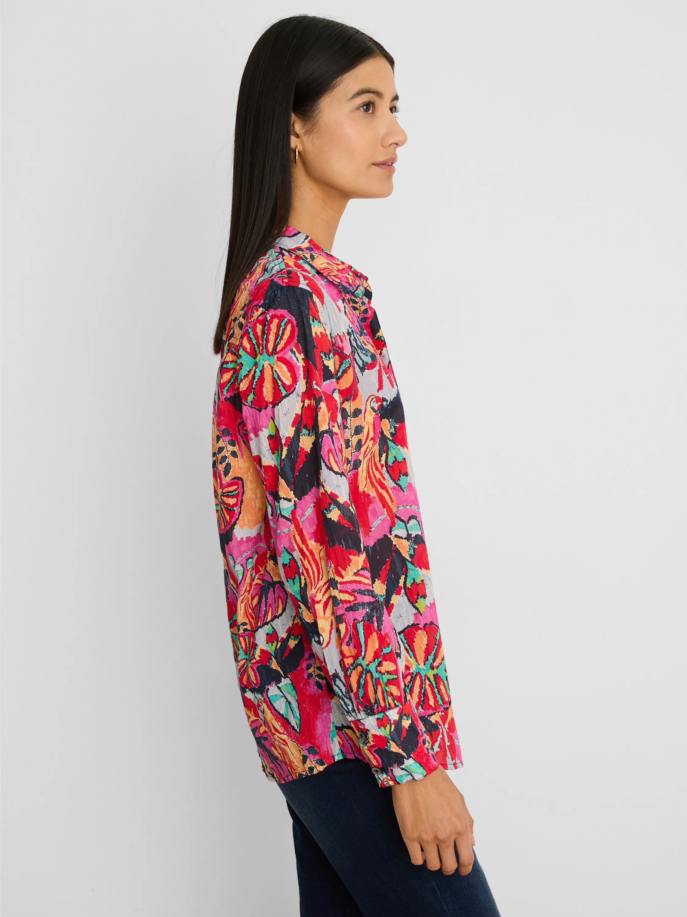 Crinkle shirt with vibrant abstract pattern in fuchsia, red, orange, teal, black, and grey.