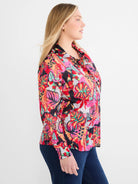 Cotton crinkle shirt with abstract floral print in red, pink, orange, teal, black, and white.