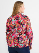 Crinkle shirt with a vibrant multi-color abstract floral pattern: red, pink, orange, teal, and black.