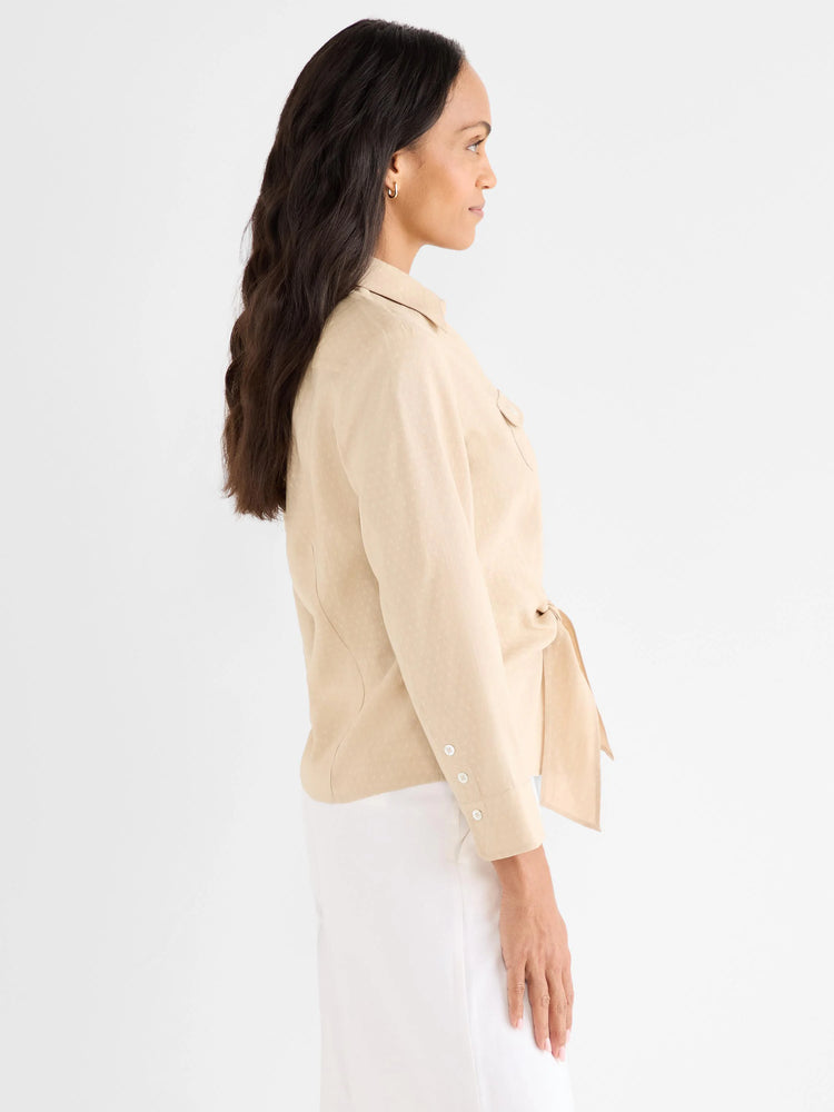 Light beige collared tie-front shirt with long sleeves, buttoned cuffs, and a subtle dotted texture.