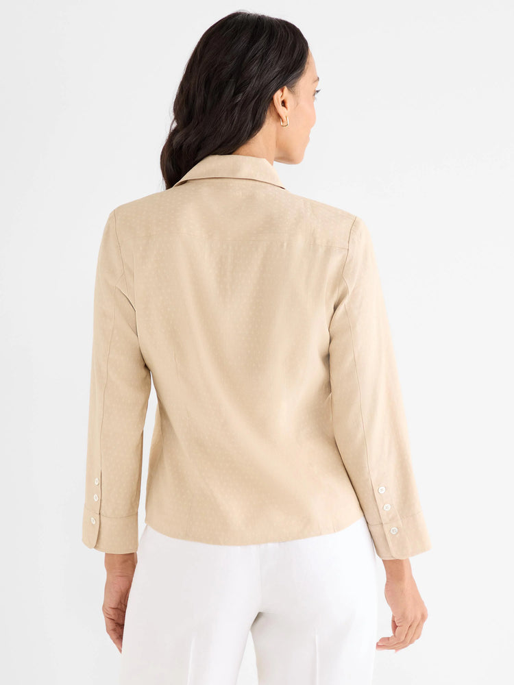 Light tan shirt, back view, with long sleeves, buttoned cuffs, and a subtle dotted texture.