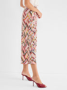 These fluid, cropped pants have a relaxed fit and feature a vibrant multicolor geometric basketweave print.