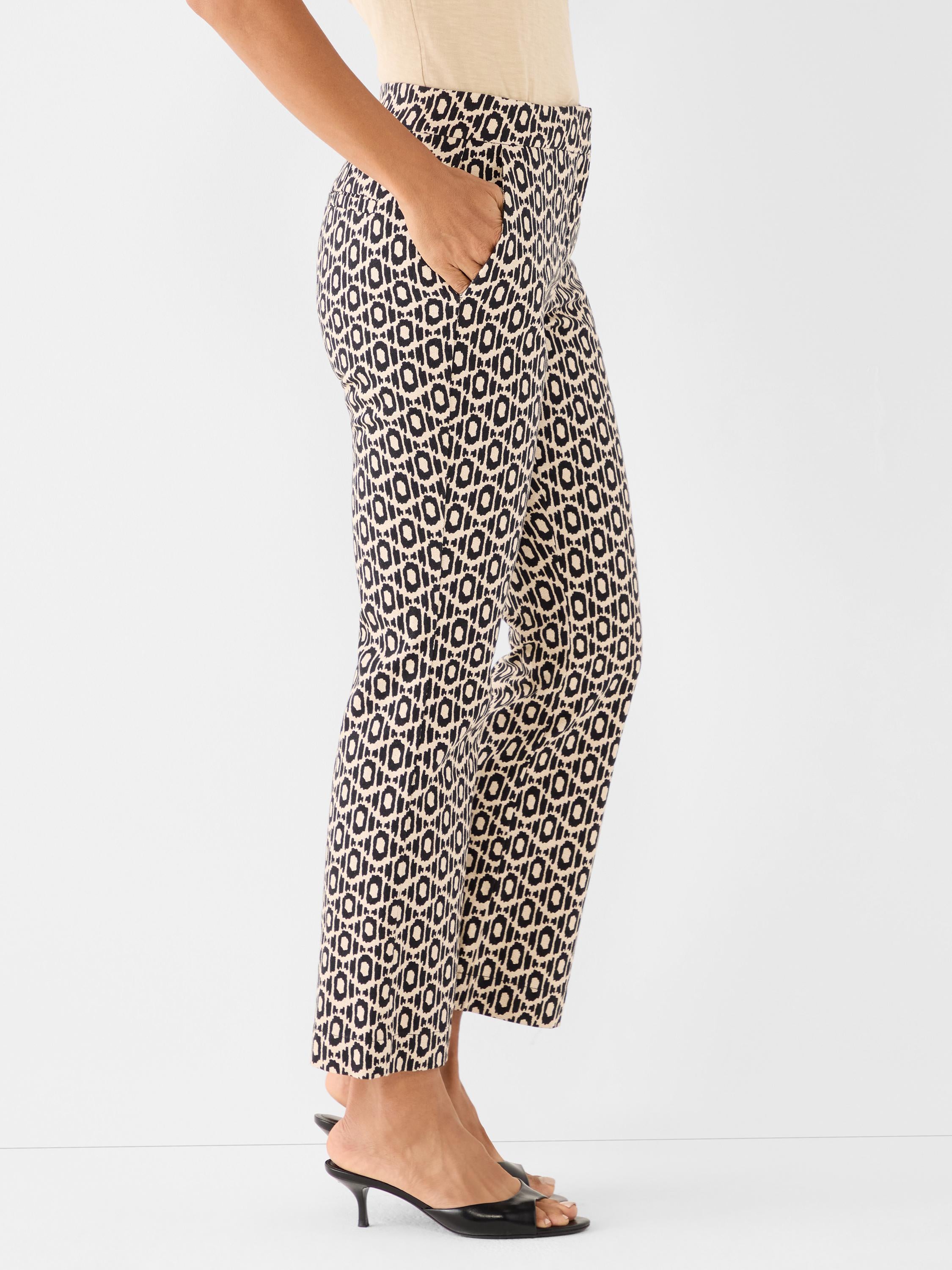 High-waisted, slim-fit cropped trousers in a tan and black geometric print feature useful slip pockets.