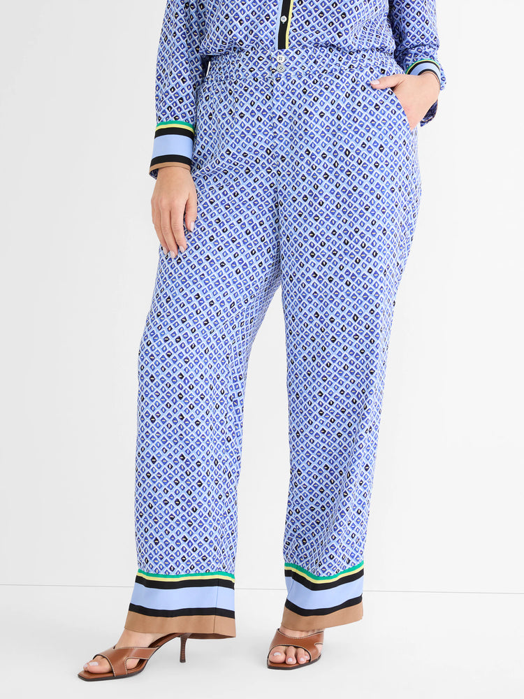 Blue wide-leg pants with a light & dark blue diamond mosaic pattern. Cuffs have multi-colored stripes.