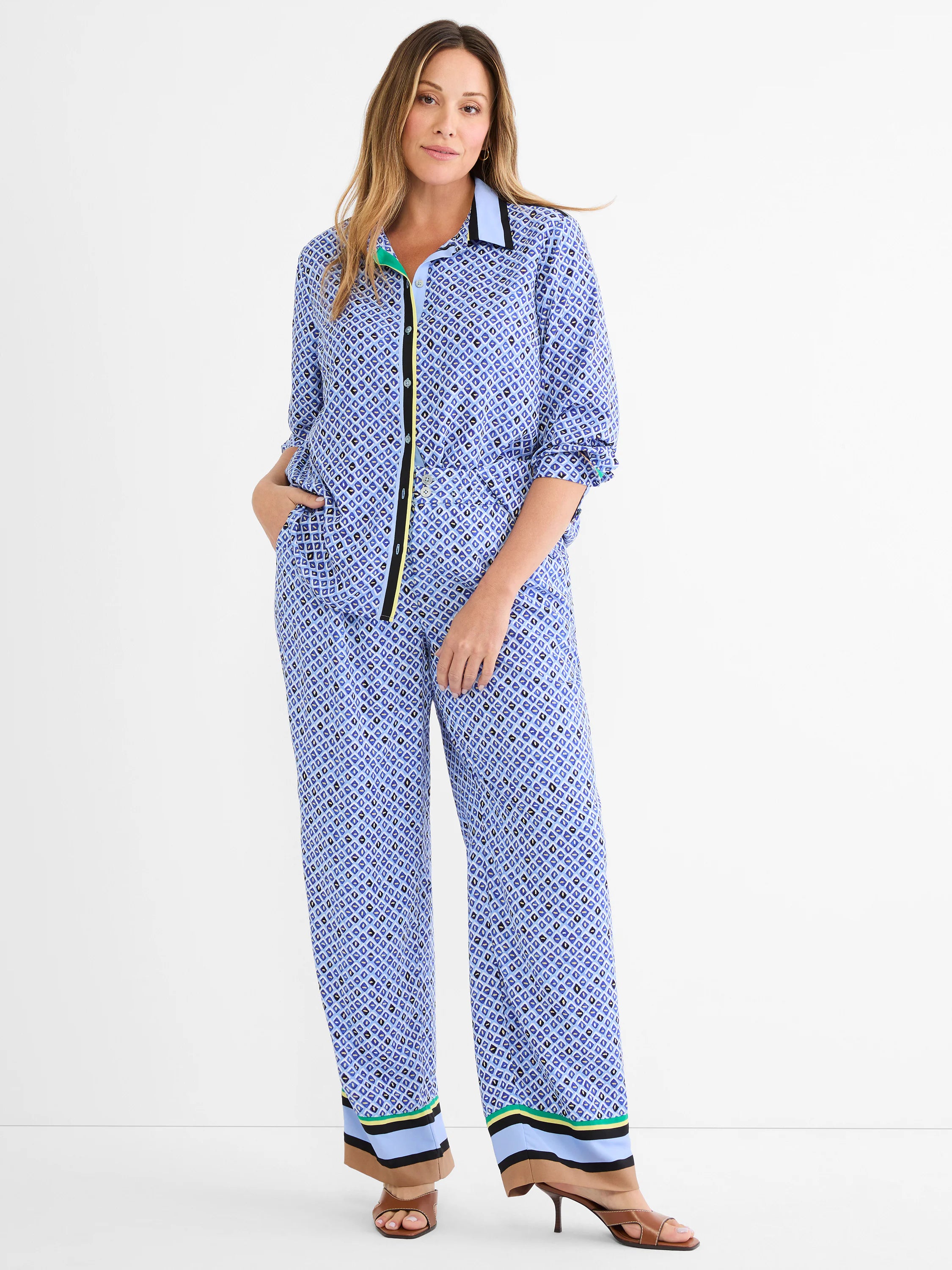 Wide-leg pants with blue, black, white mosaic pattern. Striped cuffs in light blue, black, tan, green, yellow.