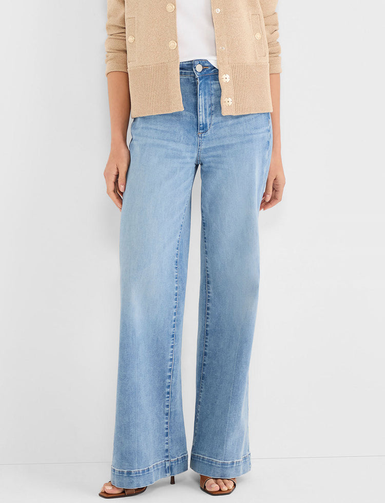 High-waisted light wash blue denim jeans feature a wide-leg cut and clean front closure.