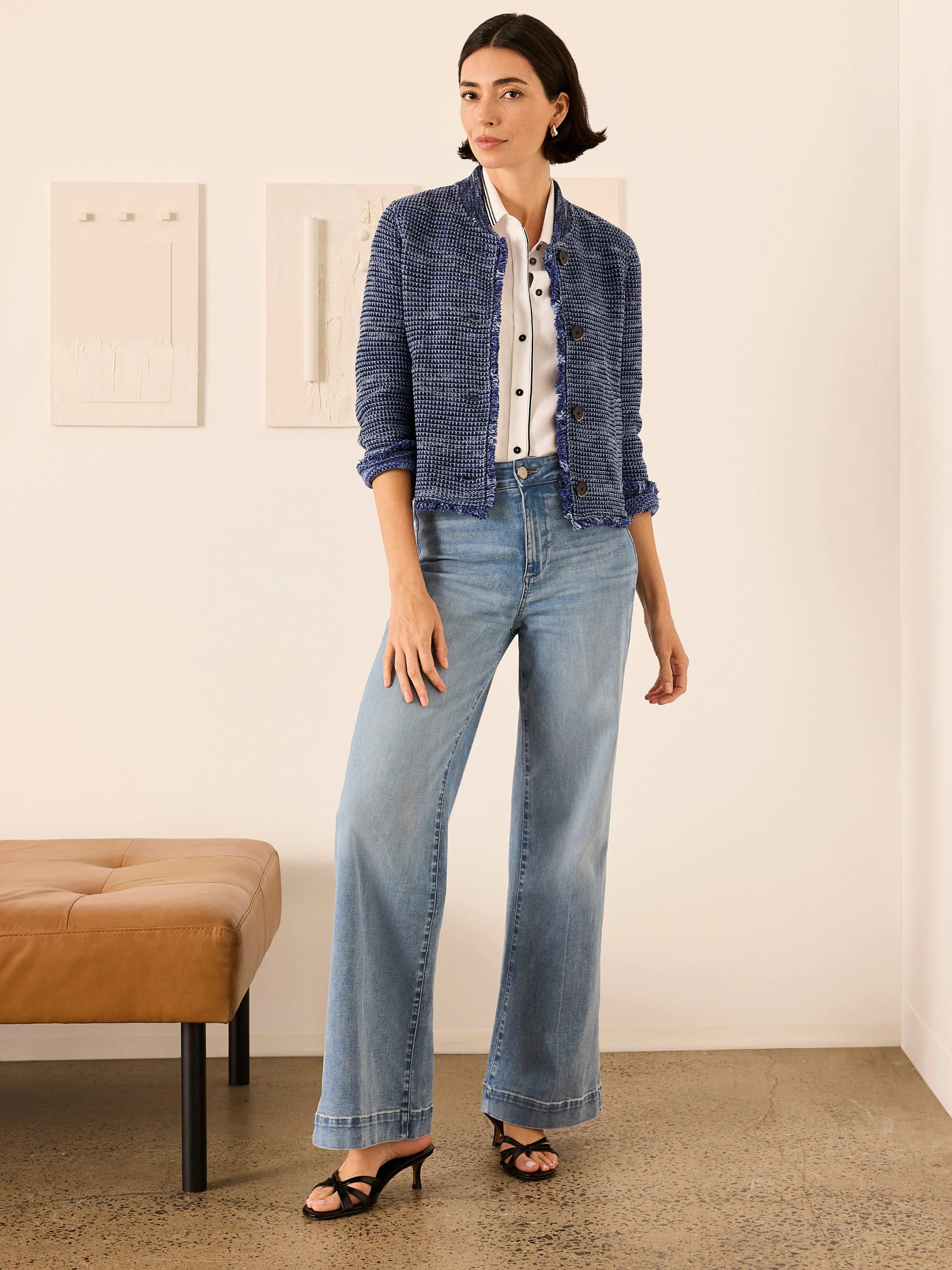 Light blue, high-rise, wide-leg denim jeans shown full length on a model.