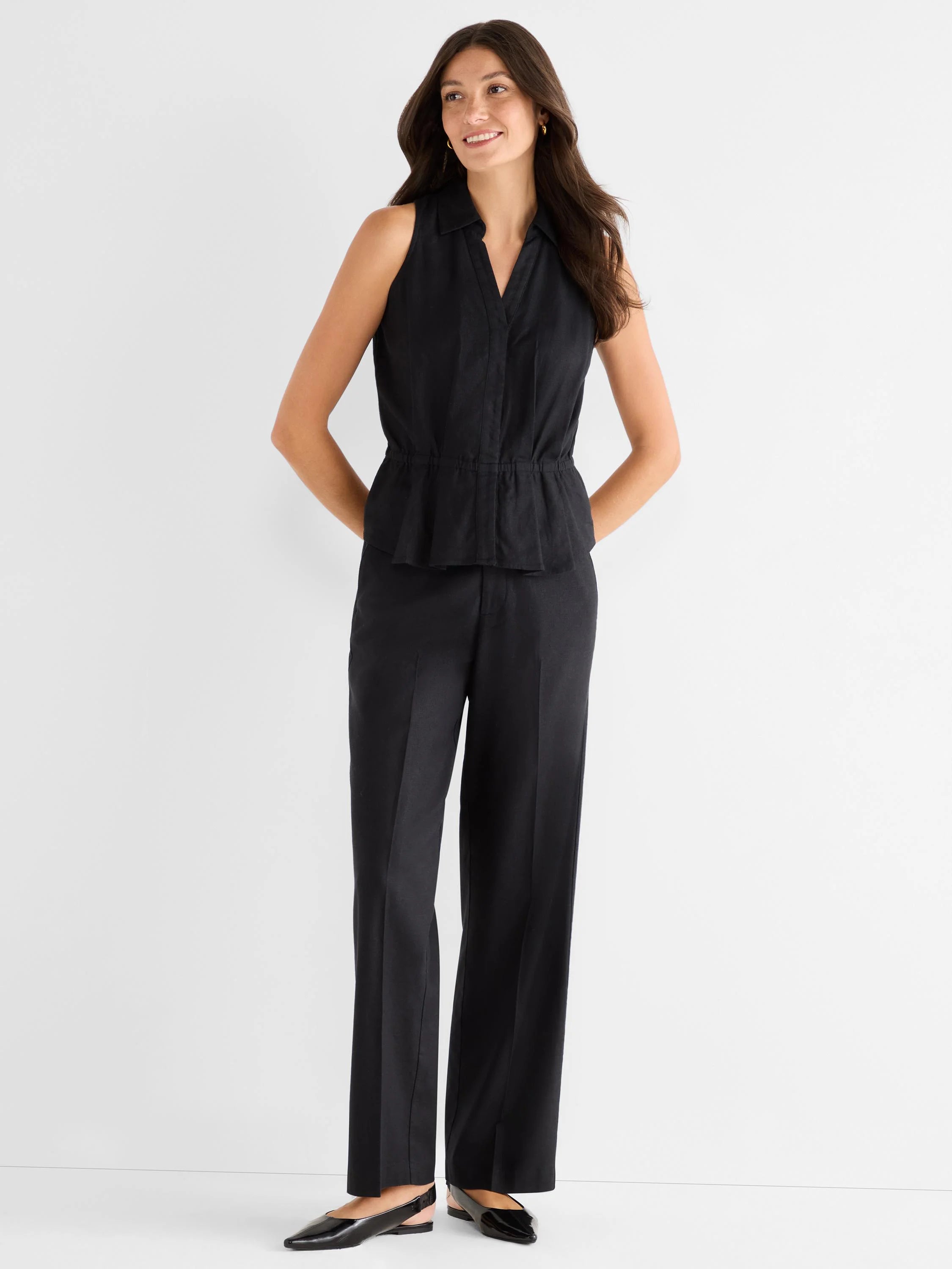 Black wide-leg stretch linen pants, shown full-length on a model.