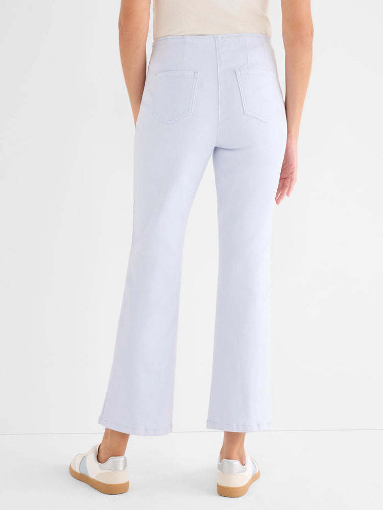 Pale blue high-waisted boot-cut jeans with back patch pockets and vertical leg seams.