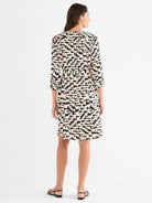 Relaxed fit multicolor abstract print dress with 3/4 sleeves and a self-tie waist, ending at the knee.