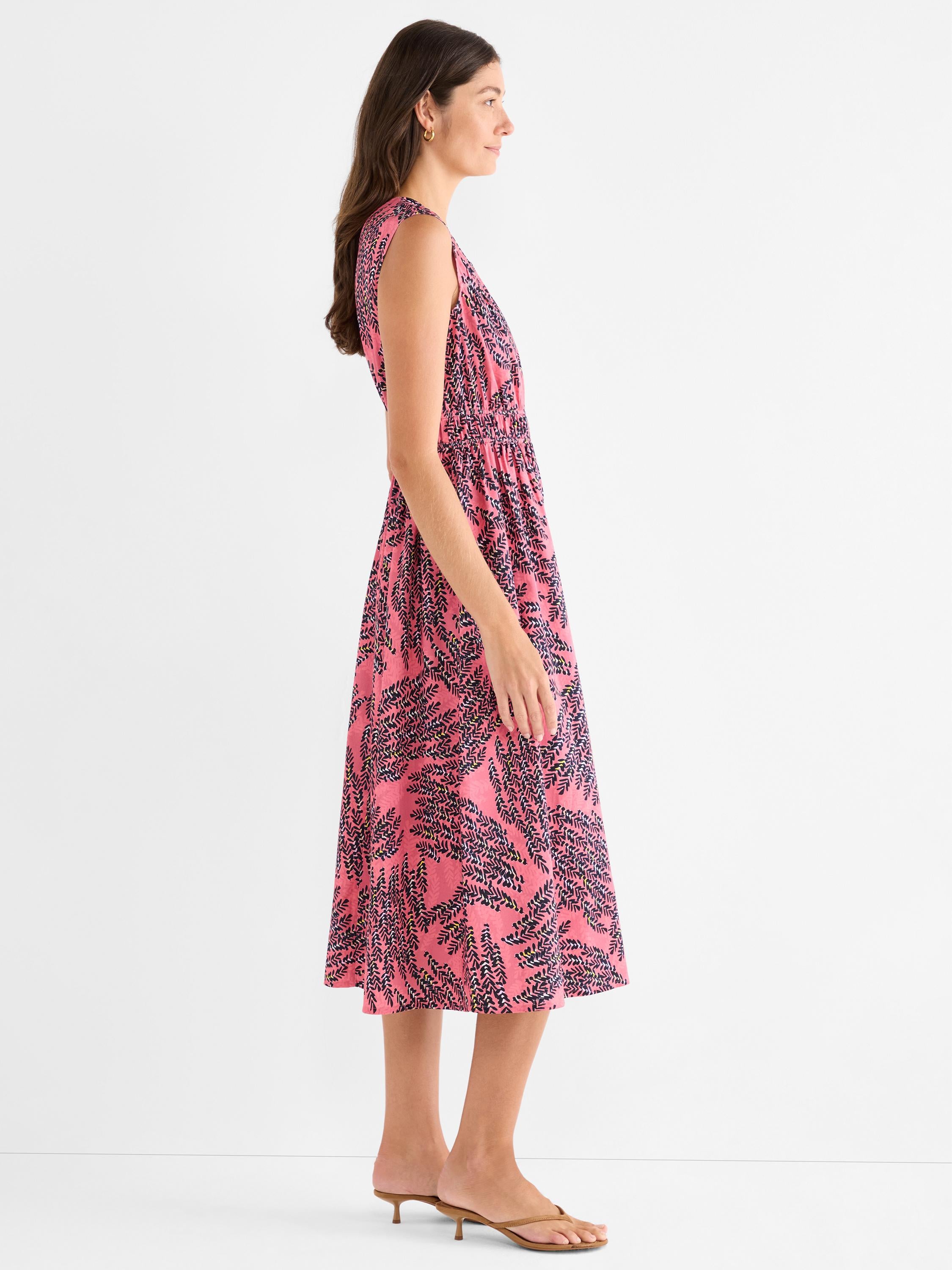 Pink sleeveless midi dress with a black abstract print and an elastic cinched waist for a comfortable, airy fit.