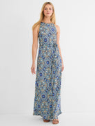 Maxi dress with high neck, sleeveless, and self-tie belt. Features an intricate blue, yellow, and black tile pattern.